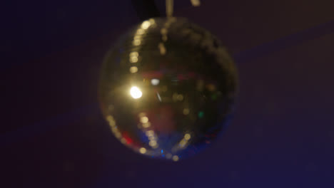 Shot-Of-Defocused-Mirrorball-Slowly-Revolving-In-Night-Club-Or-Disco